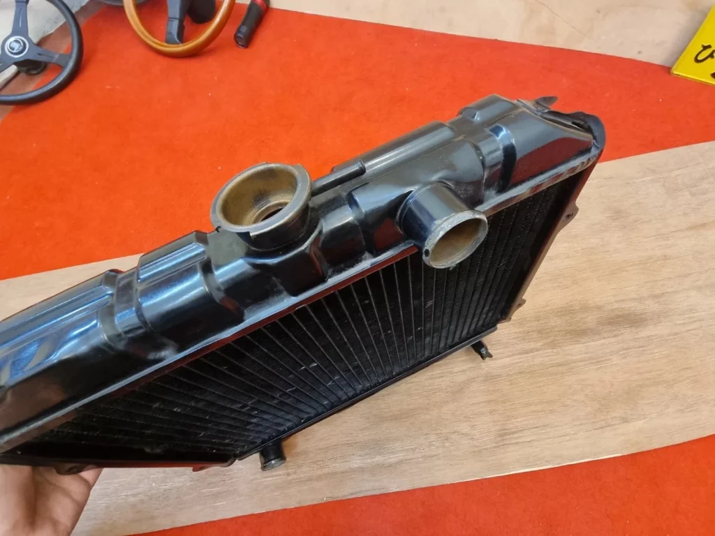 ke26 NOS OEM radiator 5