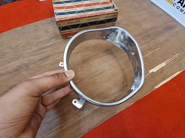 Datsun Sunny 1200 B110 headlight bezel left side2