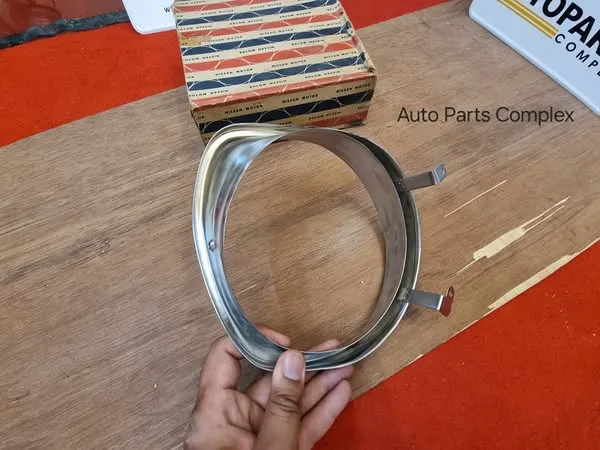 Datsun Sunny 1200 B110 headlight bezel left side3