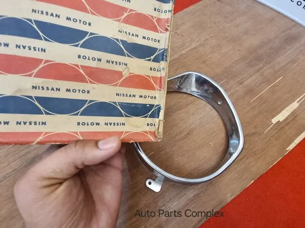 Datsun Sunny 1200 B110 headlight bezel left side4