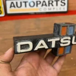 NISSAN DATSUN 720 TRUCK PICK UP FRONT GRILLE EMBLEM BADGE 1