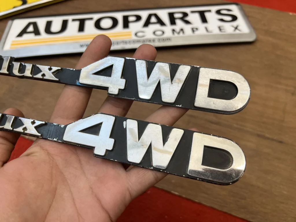 Toyota Hilux pickup 1979 - 1983 RN30 RN40 4WD fender badges pair (3)