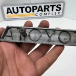 Toyota Hilux 1979 1980 RN30 RN40 RN36 grille badge OEM used (1)