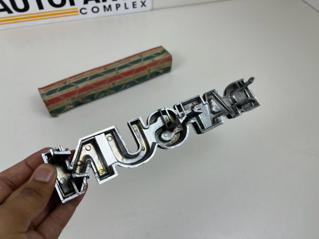 DATSUN 720 Pickup Front Grille Emblem Badge NOS (1)
