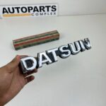 DATSUN 720 Pickup Front Grille Emblem Badge NOS (2)