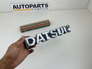 DATSUN 720 Pickup Front Grille Emblem Badge NOS (2)