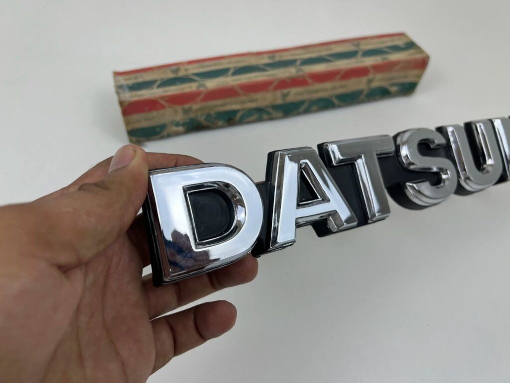 DATSUN 720 Pickup Front Grille Emblem Badge NOS (3)