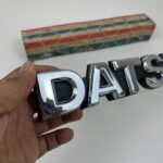 DATSUN 720 Pickup Front Grille Emblem Badge NOS (3)
