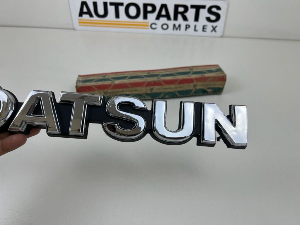 DATSUN 720 Pickup Front Grille Emblem Badge NOS (4)