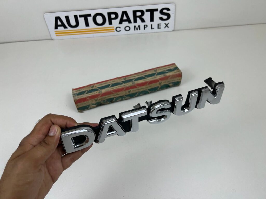 DATSUN 720 Pickup Front Grille Emblem Badge NOS (5)