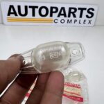 Toyota Hilux rn30 rn40 rn43 license plate light lenses NOS OEM pair (4)